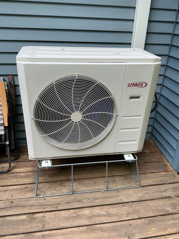 Performed comprehensive air conditioning tune-up on 2-year-old Lennox unit. Cleaned indoor filters and conducted full system inspection. Disassembled outdoor unit due to known rodent intrusion history and discovered active mouse nest with occupants inside condenser cabinet. Removed all nesting material and debris, reassembled unit, and performed thorough coil rinse on outdoor condenser. System test confirmed proper operation with 20-degree temperature split, indicating optimal cooling performance.