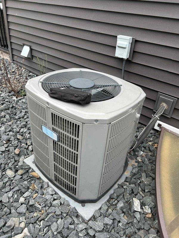 Performed comprehensive air conditioning tune-up on 5-year-old residential condensing unit. Completed full system inspection including condenser coil examination, internal component assessment, electrical connections verification, and refrigerant line inspection. All components found operating within normal parameters with no deficiencies identified. Equipment running properly with optimal performance confirmed.