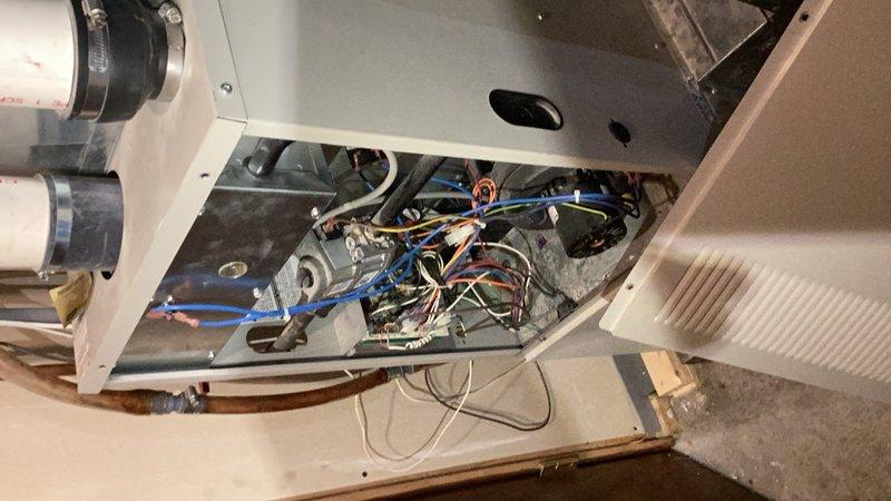 Responded to no cooling call on residential air conditioning system. Upon inspection, discovered rodent damage with mice having chewed through multiple electrical wires within the outdoor condensing unit, preventing system operation despite receiving power. System was also found to be low on R22 refrigerant. Due to the extent of wire damage, use of obsolete R22 refrigerant, and system age, recommended full HVAC system replacement rather than repair.