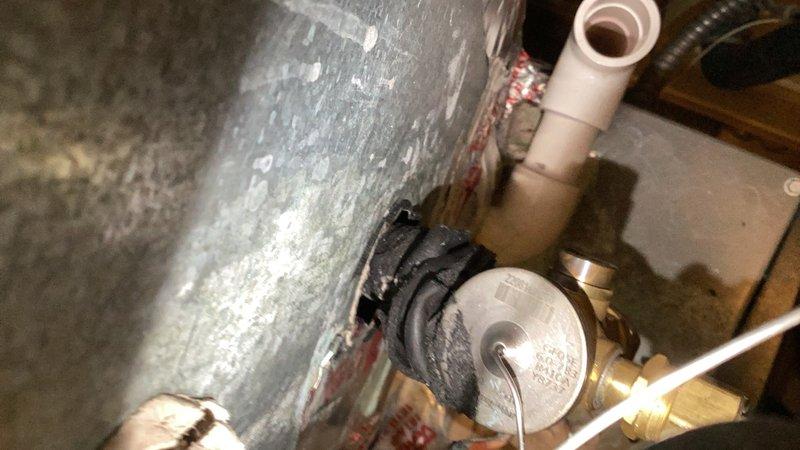 Responded to a no-cooling complaint and found the evaporator coil completely iced up. After allowing the coil to thaw, performed comprehensive system diagnostics including condenser inspection, refrigerant level check, and blower assessment. Cleaned the heavily soiled condenser coil which was obstructed with outdoor debris and plant matter. Testing revealed a faulty thermostatic expansion valve (TXV) causing improper refrigerant metering and system icing. Replaced the TXV under parts warranty and cycled the system to verify proper operation. 

Discovered significant water accumulation in the drain pan beneath the furnace, which had caused the safety float switch to trip. Removed standing water from the pan and dried out the wet switch to restore normal operation. Recharged the system with refrigerant to manufacturer specifications and balanced airflow throughout. Conducted final system testing to confirm proper cooling operation, adequate airflow, and correct superheat and subcooling r