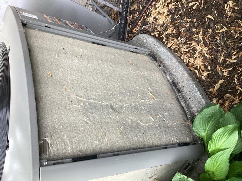 Responded to a no-cooling complaint and found the evaporator coil completely iced up. After allowing the coil to thaw, performed comprehensive system diagnostics including condenser inspection, refrigerant level check, and blower assessment. Cleaned the heavily soiled condenser coil which was obstructed with outdoor debris and plant matter. Testing revealed a faulty thermostatic expansion valve (TXV) causing improper refrigerant metering and system icing. Replaced the TXV under parts warranty and cycled the system to verify proper operation. 

Discovered significant water accumulation in the drain pan beneath the furnace, which had caused the safety float switch to trip. Removed standing water from the pan and dried out the wet switch to restore normal operation. Recharged the system with refrigerant to manufacturer specifications and balanced airflow throughout. Conducted final system testing to confirm proper cooling operation, adequate airflow, and correct superheat and subcooling r