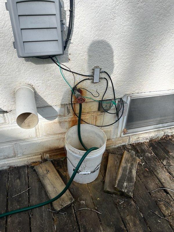 Responded to service call for two leaking valves at the property. Upon inspection, identified a malfunctioning exterior hose bib and its associated shut-off valve, along with a leaking valve in the laundry room with a broken handle. The exterior hose shut-off valve was non-functional and required complete replacement. Successfully removed and replaced the defective exterior hose bib and shut-off valve assembly. Replaced the faulty laundry room valve and installed a new valve handle. All connections were tested for proper operation and verified leak-free. Photographic documentation captured the exterior hose bib installation area and the laundry room plumbing fixtures with new chrome shut-off valves featuring blue handles mounted to the PVC supply line. System restored to full functionality with no water shut-off required during repairs.
