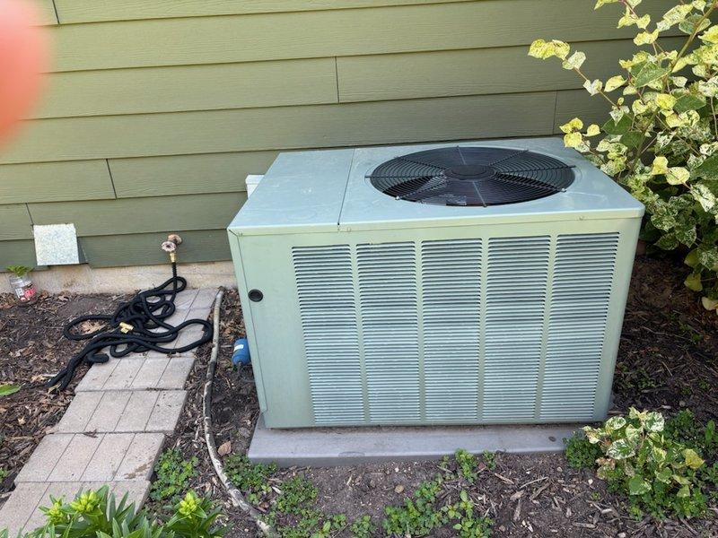 Responded to no cooling complaint on 15-year-old Ruud air conditioning system. Diagnosed system low on refrigerant with active leak present. Measured temperature split at 16 degrees across coil, indicating inadequate cooling capacity. Evaporator coil temperature reading of 34 degrees approaching freezing point due to low refrigerant charge. Verified air filter clean, evaporator coil clean, and blower operating at correct fan speed. Discussed repair and replacement options with homeowner and provided written estimates via email. Scheduled follow-up appointment with service advisor to finalize solution.