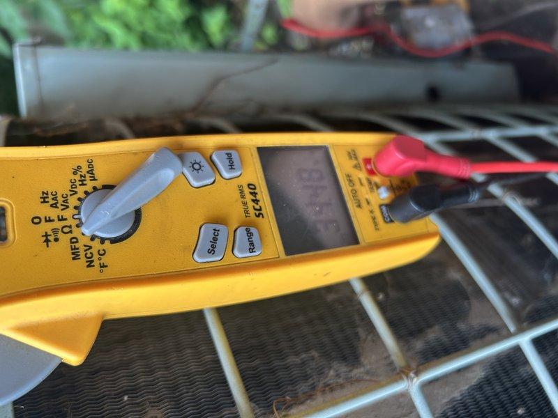 Responded to no cooling call on aging HVAC system with 40+ year-old condenser and 20 year-old furnace that had shut down overnight with no air movement through vents. Upon arrival, found failed blower motor capacitor reading only 3 microfarads out of rated 7.5 microfarads. Replaced defective capacitor and performed quick condenser coil wash during service. After capacitor replacement, system restored to operational status with good cooling performance. Post-repair testing revealed refrigerant charge concerns with superheat measuring approximately 1° and subcooling reading around 50°, indicating potential airflow restrictions or system wear consistent with equipment age. Consulted with technical support regarding airflow and refrigerant readings to determine root cause. Given the advanced age of the equipment and current satisfactory cooling performance, advised homeowner of system condition and potential future concerns related to overall wear. System left in operational condition with