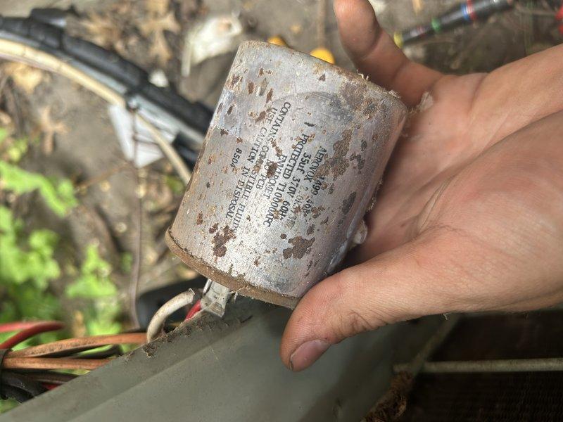 Responded to no cooling call on aging HVAC system with 40+ year-old condenser and 20 year-old furnace that had shut down overnight with no air movement through vents. Upon arrival, found failed blower motor capacitor reading only 3 microfarads out of rated 7.5 microfarads. Replaced defective capacitor and performed quick condenser coil wash during service. After capacitor replacement, system restored to operational status with good cooling performance. Post-repair testing revealed refrigerant charge concerns with superheat measuring approximately 1° and subcooling reading around 50°, indicating potential airflow restrictions or system wear consistent with equipment age. Consulted with technical support regarding airflow and refrigerant readings to determine root cause. Given the advanced age of the equipment and current satisfactory cooling performance, advised homeowner of system condition and potential future concerns related to overall wear. System left in operational condition with