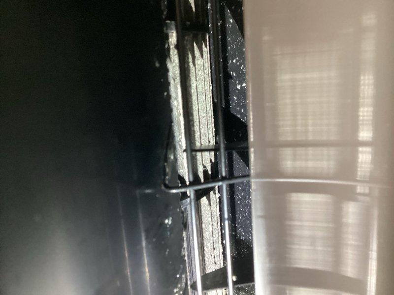 Responded to no cooling complaint on dual mini-split system. Inspected both units: bedroom mini-split operating normally with clean filters and proper refrigerant levels. Living room mini-split indoor unit powers on but blower fails to operate in auto mode; compressor does not engage and refrigerant does not circulate when fan set to auto. System operates properly when fan manually set to high speed. Diagnosed faulty indoor unit control board. Recommended indoor unit board replacement and scheduled comfort advisor for replacement options.