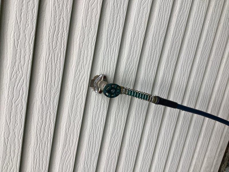 Responded to emergency call for frozen and failed exterior hose bibb that ruptured, causing water to spray inside the residence and resulting in approximately two inches of interior flooding. Coordinated with mitigation team on-site to access the affected area. Cut access hole in interior drywall to reach the damaged freeze-proof sillcock behind the wall cavity. Removed and replaced the failed hose bibb assembly, ensuring proper installation and secure mounting to exterior siding. Verified all connections were watertight and system was functioning properly upon completion.
