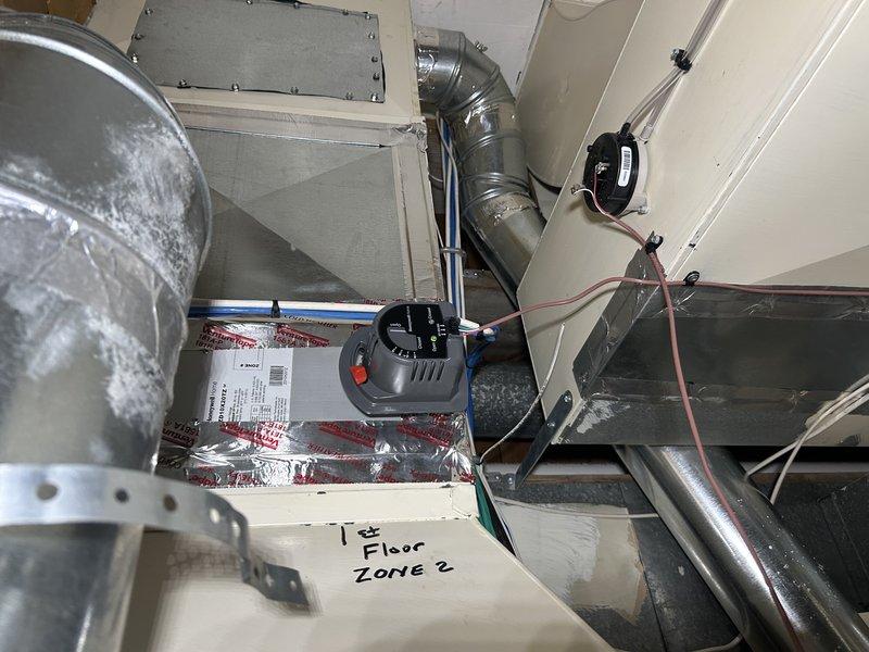Responded to no-cool complaint on recently installed system with thermostat set to 70°F but only cooling to 76°F. Upon arrival, found outdoor condenser unit moderately dirty and air filter unchanged since installation in October. Cleaned condenser coil, replaced air filter, and activated all three thermostat zones to perform comprehensive system evaluation. Verified 3-ton system airflow at 1200 CFM and adjusted blower speeds, increasing low cooling fan speed by approximately 100 CFM and optimizing dehumidification fan speed for improved performance. Conducted refrigerant charge verification using pressures and temperature measurements, confirming proper charge levels throughout system. System now operating within normal parameters with adequate airflow and cooling capacity restored.