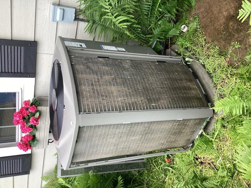 Completed comprehensive AC Rewards tune-up on two-year-old system. Found heavily clogged MERV 11 air filter restricting airflow; removed and installed temporary 1-inch filter to restore proper system operation. Removed outdoor unit covers and performed thorough washing to eliminate accumulated dirt and debris. Verified system performance with 22° temperature drop across coil and confirmed all components operating within normal parameters.