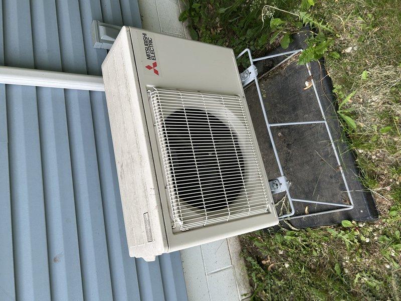Responded to no cooling complaint on two separate Mitsubishi mini split systems—one serving the main living/kitchen area and one in the back bedroom. Upon arrival, found both indoor heads producing weak airflow and inadequate cooling. Initial inspection revealed both systems had never been professionally cleaned, with indoor evaporator coils heavily clogged with dust and debris accumulation restricting airflow. Outdoor condensing unit coils were completely obscured by dirt buildup, preventing proper heat rejection.

Both systems were operational with compressors running and condensate draining properly, indicating refrigerant circuits were intact. Root cause of no cooling condition identified as severely restricted airflow due to lack of maintenance on both indoor and outdoor components.

Scheduled return visit with coil jet equipment and mini split bib cleaning kit to perform comprehensive cleaning and maintenance on both systems. Work scope includes deep cleaning of indoor evaporator