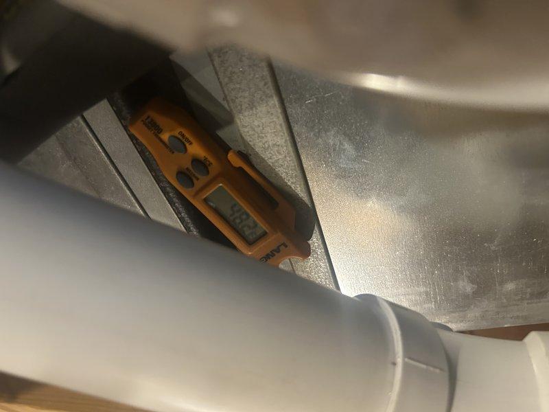 Responded to warranty call for rattling noise on recently installed air conditioning system. Upon arrival, performed initial system diagnostics including decibel readings (62 dB) and compressor amperage testing (5+ amps). System was cooling properly but noise concern required investigation. Discovered refrigerant overcharge during charge verification testing. Checked airflow prior to refrigerant adjustment. Recovered approximately 6-7 ounces of refrigerant to bring charge to manufacturer specifications. Post-adjustment testing showed reduced decibel levels and lower compressor amperage due to proper system loading. Verified unit operation within normal parameters. Customer satisfied with noise reduction and overall system performance compared to previous equipment.