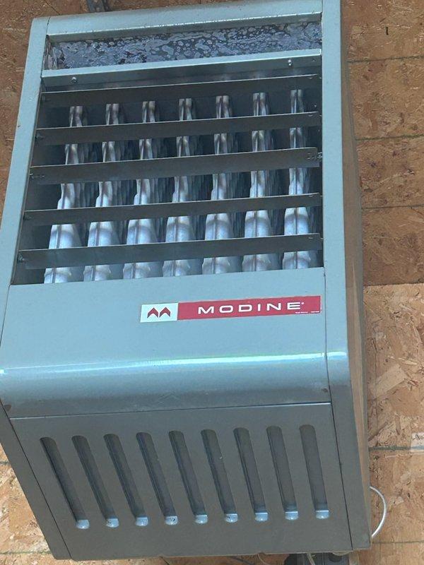 Responded to no-heat call for garage heater. Found pilot light would ignite but gas valve failed to open despite receiving proper 24-volt signal. Diagnosed faulty standing pilot gas valve preventing main burner operation. Provided estimate for gas valve replacement on Modine unit.