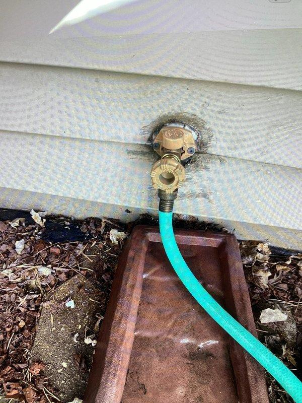 Replaced existing exterior hose bib with freeze-proof model to prevent cold weather damage. Installed up to 15 feet of PEX tubing from interior shut-off valve to new exterior fixture, utilizing close-quarter pro press jaws for secure copper connections in medium-access crawl space. Removed corroded original hose bib showing significant exterior staining and weathering on foundation area. Completed all connections with proper shut-off valve installation, tested system for leaks, and verified full functionality of new freeze-proof hose bib.