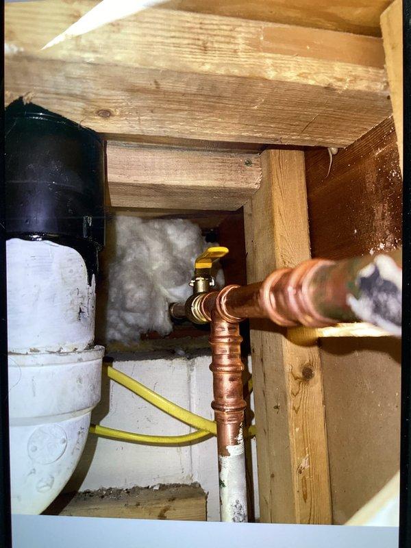 Replaced existing exterior hose bib with freeze-proof model to prevent cold weather damage. Installed up to 15 feet of PEX tubing from interior shut-off valve to new exterior fixture, utilizing close-quarter pro press jaws for secure copper connections in medium-access crawl space. Removed corroded original hose bib showing significant exterior staining and weathering on foundation area. Completed all connections with proper shut-off valve installation, tested system for leaks, and verified full functionality of new freeze-proof hose bib.