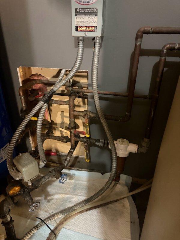 Responded to an active pipe leak located in the wall behind the washing machine. Upon investigation, identified a failed solder joint on an aged copper water line as the source of the leak. Isolated the affected section and replaced the compromised pipe segment with PEX piping to restore water supply and eliminate the leak. Documented the existing plumbing infrastructure, which showed signs of age and deterioration throughout the system. Recommended comprehensive repipe evaluation due to the condition of the existing copper plumbing and multiple areas of concern observed during the repair.