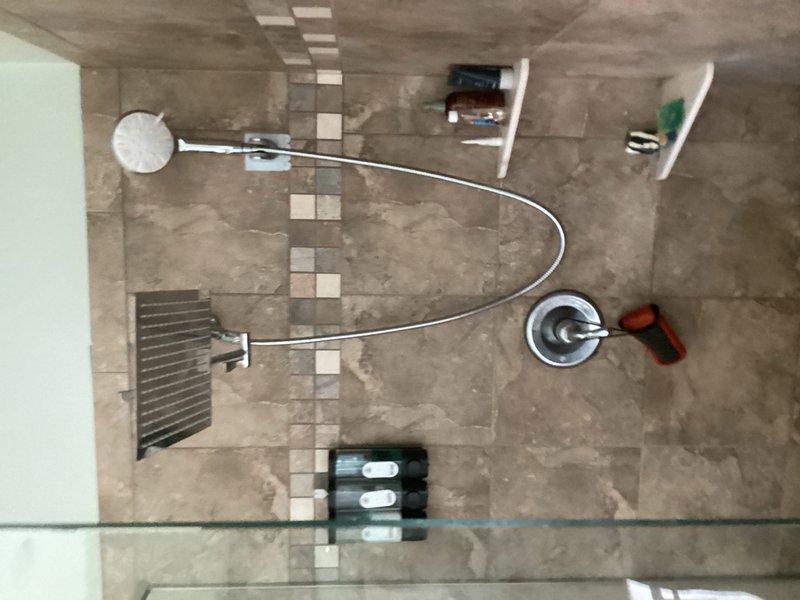 Completed comprehensive plumbing inspection of residential property, including examination of basement utility area with PEX manifold distribution system and newly renovated bathroom with updated shower fixtures and tile work. All plumbing systems, connections, and fixtures were visually inspected and found to be in proper working order with no leaks or deficiencies noted at time of inspection.