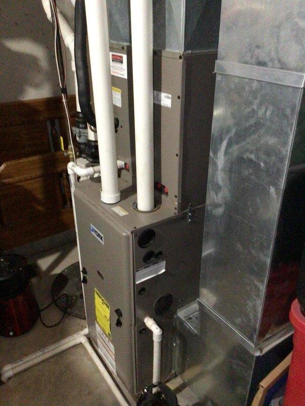 Performed comprehensive air conditioning tune-up on residential HVAC system with Trane TM9X furnace. System was found to be one pound low on R-410A refrigerant; recharged to factory specifications and verified proper cooling operation. All electrical components tested within manufacturer specifications, replaced air filter, and performed condenser coil cleaning on outdoor unit.