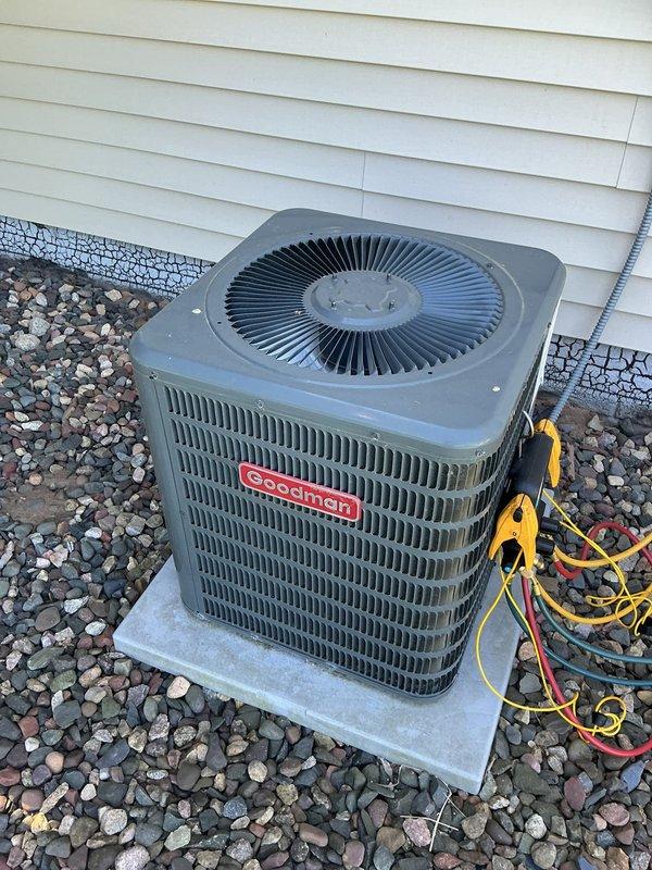 Responded to no cooling complaint on 10+ year old Goodman air conditioning system. Upon arrival, confirmed unit was not producing cool air and indoor temperature was rising. Performed diagnostic inspection of both outdoor condenser unit and indoor Bryant furnace/air handler system. No ice formation or condensation observed on refrigerant lines during initial visual inspection. Connected testing equipment to outdoor condenser unit to check system pressures and refrigerant charge. Diagnostic testing revealed system was completely empty of refrigerant, indicating a significant leak within the refrigerant circuit. Due to age of equipment and severity of refrigerant loss, recommended full system replacement rather than repair. Scheduled estimate appointment for new AC system installation. Documented equipment conditions with photos of outdoor condenser unit and indoor air handler for replacement planning purposes.