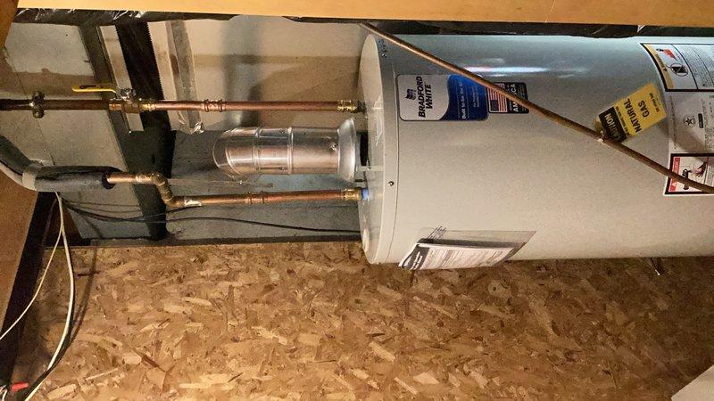 Responded to emergency call for leaking water heater with faulty temperature and pressure relief valve. Upon arrival, immediately shut off water supply and gas to the 2012 unit to prevent further water damage and safety hazards. Performed diagnostic assessment confirming the 12-year-old tank water heater had failed beyond economical repair. Provided estimate for replacement with new 40-gallon natural gas water heater with atmospheric (natural draft) venting system to restore hot water service to the property.