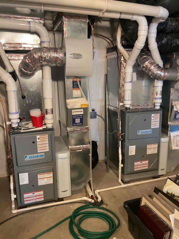 Responded to no cooling condition on multi-zone Daikin HVAC system where unit was running but delivering warm air. Upon diagnosis, identified failed zone control board with missing terminal clip causing two zones to be improperly tied together. Replaced defective zone board and restored proper system operation.