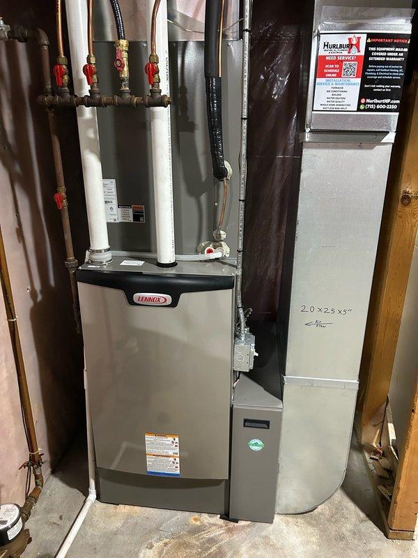 Responded to no cool call on 3.5-month-old air conditioning system. Upon arrival, found S40 thermostat displaying Alert 411 and outdoor control board showing Error E411. Inspected air filter and verified blower CFM settings, making necessary adjustments to blower motor speed. Performed refrigerant charge analysis and discovered system was extremely low on refrigerant. Added refrigerant to restore immediate cooling capability. Cleaned outdoor coil to optimize airflow and system performance. Advised that low refrigerant level on such a new system indicates potential manufacturer defect or refrigerant leak requiring further investigation. System restored to normal cooling operation. Recommended monitoring system performance and scheduling follow-up visit if cooling issues return to perform comprehensive leak detection and identify root cause of refrigerant loss.