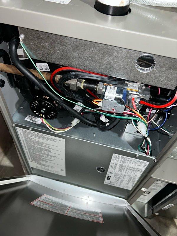 Responded to no cool call on 3.5-month-old air conditioning system. Upon arrival, found S40 thermostat displaying Alert 411 and outdoor control board showing Error E411. Inspected air filter and verified blower CFM settings, making necessary adjustments to blower motor speed. Performed refrigerant charge analysis and discovered system was extremely low on refrigerant. Added refrigerant to restore immediate cooling capability. Cleaned outdoor coil to optimize airflow and system performance. Advised that low refrigerant level on such a new system indicates potential manufacturer defect or refrigerant leak requiring further investigation. System restored to normal cooling operation. Recommended monitoring system performance and scheduling follow-up visit if cooling issues return to perform comprehensive leak detection and identify root cause of refrigerant loss.