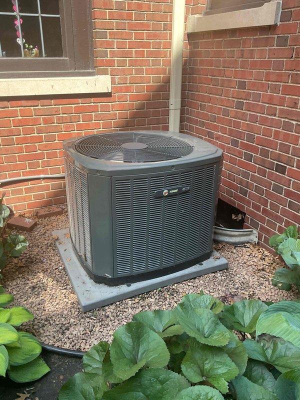Responded to no cooling complaint on 12-year-old Trane system experiencing repeated short cycling issues. Upon arrival, found condenser unit shutting down prematurely with no cooling delivered to home. Connected refrigerant manifold gauges and diagnosed system overcharge condition with pressures reading 112.2 PSIG low side and 309.7 PSIG high side, significantly above manufacturer specifications. This overcharge was causing compressor to cycle on high pressure safety, resulting in inadequate cooling and premature shutdowns observed during previous service visits. Recovered excess refrigerant from system to bring charge levels back to proper specifications per manufacturer guidelines. Monitored system operation through multiple cycles to verify stable pressures and proper compressor runtime. Unit now operating within normal parameters with appropriate cooling delivery throughout home.