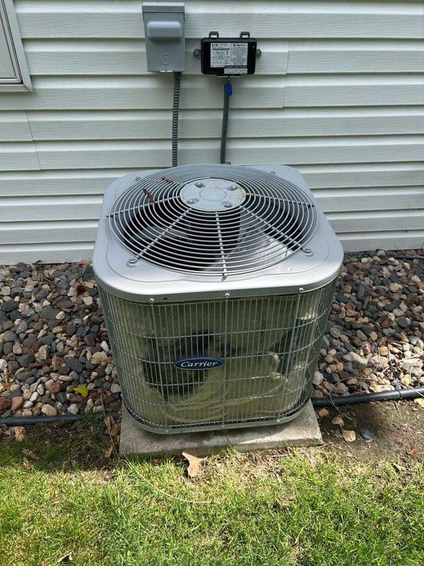 Responded to no cooling complaint on 11-year-old Carrier central air conditioning system. Upon inspection, discovered failed capacitor and heavily contaminated outdoor condenser coil restricting airflow. Refrigerant pressures tested within acceptable range, but system exhibited signs of refrigerant starvation due to reduced heat exchange efficiency from dirty coil. Performed thorough coil cleaning to restore proper airflow and heat transfer, replaced defective capacitor to restore compressor and fan motor operation. System tested and returned to normal cooling operation.