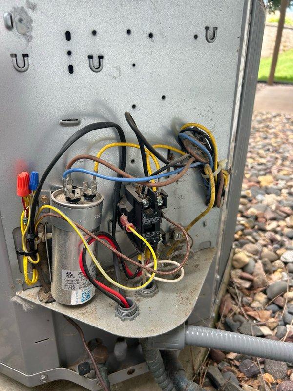 Responded to no cooling complaint on 11-year-old Carrier central air conditioning system. Upon inspection, discovered failed capacitor and heavily contaminated outdoor condenser coil restricting airflow. Refrigerant pressures tested within acceptable range, but system exhibited signs of refrigerant starvation due to reduced heat exchange efficiency from dirty coil. Performed thorough coil cleaning to restore proper airflow and heat transfer, replaced defective capacitor to restore compressor and fan motor operation. System tested and returned to normal cooling operation.