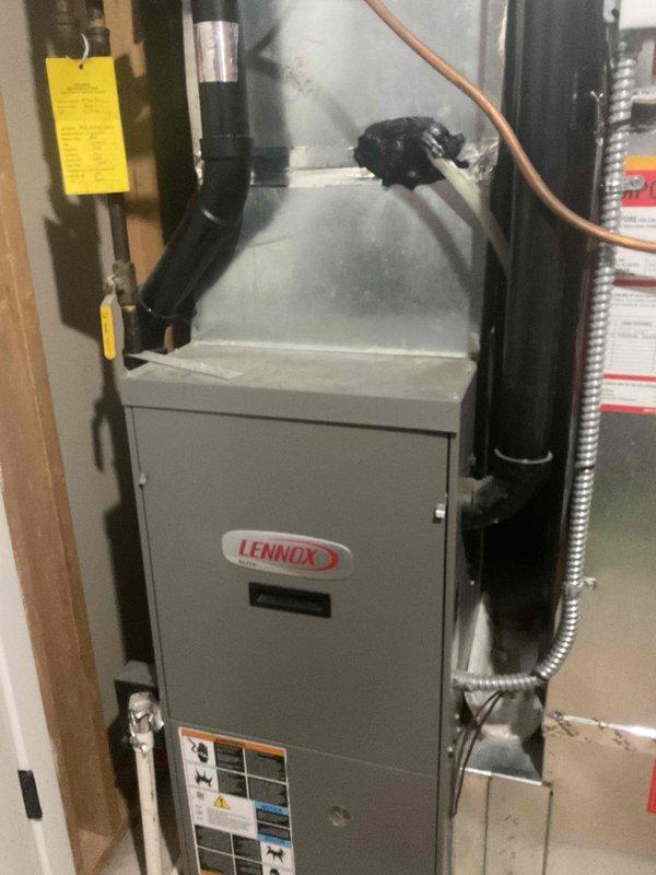 Responded to no cooling complaint on 2009 Lennox system. Upon arrival, customer had already replaced filter and cleaned condenser coils. Performed diagnostic evaluation of both indoor furnace unit and outdoor condensing unit. System operational with no fault codes present, no refrigerant freeze-up observed on coil, and all components functioning within normal parameters at time of inspection. No repairs required.