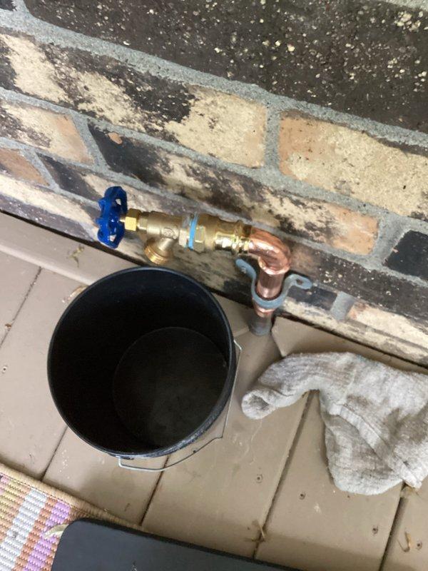 Replaced failed front hose bibb with 3/4" threaded valve and adapter assembly. The original fixture had a compromised solder joint that was causing failure. Removed the defective soldered connection and installed a new brass valve with compression fittings and copper adapters. The new threaded configuration allows for easier future replacement and maintenance without requiring soldering. Secured copper piping to brick wall with mounting brackets to ensure proper support. Tested valve operation and verified proper water flow and shutoff control upon completion.