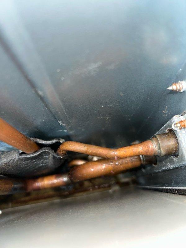 Completed annual preventive maintenance visit on a mini split air conditioning system with two indoor wall-mounted heads. Performed comprehensive tune-up inspection including thermostat function verification, filter condition assessment, blower assembly examination, outdoor coil inspection, electrical component testing, condensate drain check, and refrigerant performance evaluation. Measured temperature split across the system to verify proper cooling capacity. Inspected copper refrigerant lines and insulation for integrity, checking for signs of wear, leaks, or damage. Examined all soldered joints and brass fittings on refrigerant piping. Cleaned and evaluated air filters on both indoor heads, confirming proper airflow. All operational parameters and temperature readings were within manufacturer specifications. No mechanical defects, refrigerant leaks, electrical issues, or safety concerns identified. System operating properly at time of service completion.