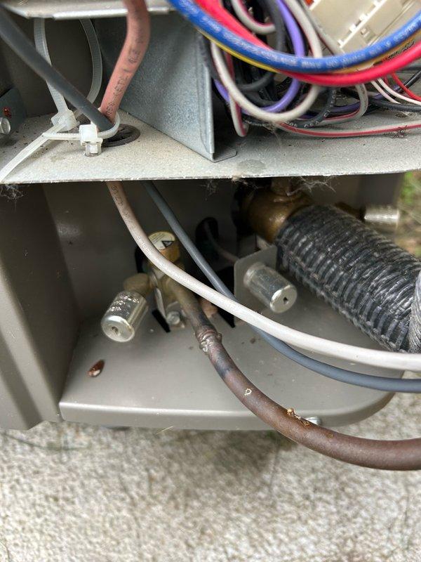 Completed comprehensive heat pump tune-up and maintenance inspection per agreement with no reported issues. Performed thorough system evaluation including thermostat operation, air filter assessment, blower assembly inspection, outdoor coil examination, electrical component testing, contactor inspection, condensate drain verification, refrigerant performance analysis, and temperature split measurements. All operational parameters and readings confirmed within manufacturer specifications with no mechanical defects or safety concerns identified. System verified operating efficiently and properly. Documented equipment condition with photos showing outdoor unit louvers and internal components including refrigerant lines, electrical connections, and cabinet interior. Advised customer to maintain regular filter changes, keep indoor and outdoor coils clean, and continue scheduled preventive maintenance to ensure optimal system performance and longevity.