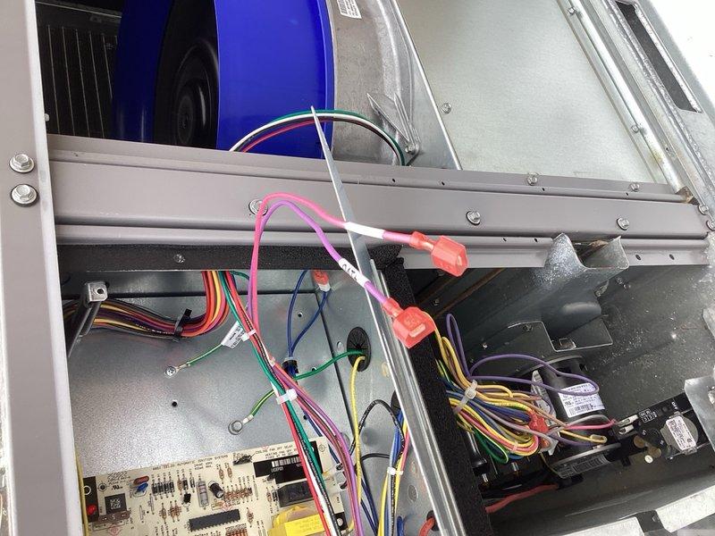 Responded to no cooling complaint on two Carrier RTU units. Upon inspection, found both units displaying economizer alarms and unable to enter cooling mode. Discovered outdoor air sensor wiring disconnected on both units. Reconnected the sensor wiring and cleared alarm codes. During system diagnostics, determined that the units require CO2 sensors to be installed for proper compressor operation in cooling mode. The equipment is configured to prevent cooling cycle without functional CO2 sensor input as part of the economizer control strategy. Verified all other system components operational. Documented control board wiring configurations and economizer module settings. Requested two CO2 sensors for installation to restore full cooling functionality to both rooftop units.