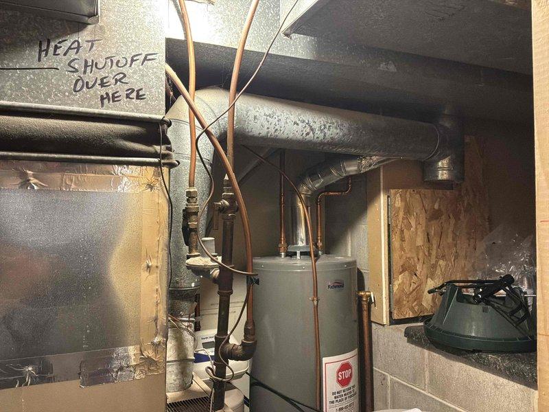 Completed phone follow-up to update existing estimate by adding furnace to previously quoted air conditioning system. Inspected and photographed basement mechanical area containing existing HVAC equipment and water heater to prepare comprehensive bid for furnace installation. Customer expressed enthusiasm about proceeding with both furnace and AC replacement and requested information on current promotional offers.