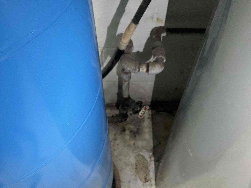 Responded to service call for non-functional 40-gallon water heater with no hot water production. Upon inspection, assessed existing tank-style water heater system and surrounding plumbing infrastructure in mechanical room. Documented current installation including water supply lines, pressure relief valve configuration, and existing piping connections. Discussed replacement options with customer, including conventional tank water heater versus tankless system alternatives. Photographed existing equipment and installation for replacement planning and customer review.