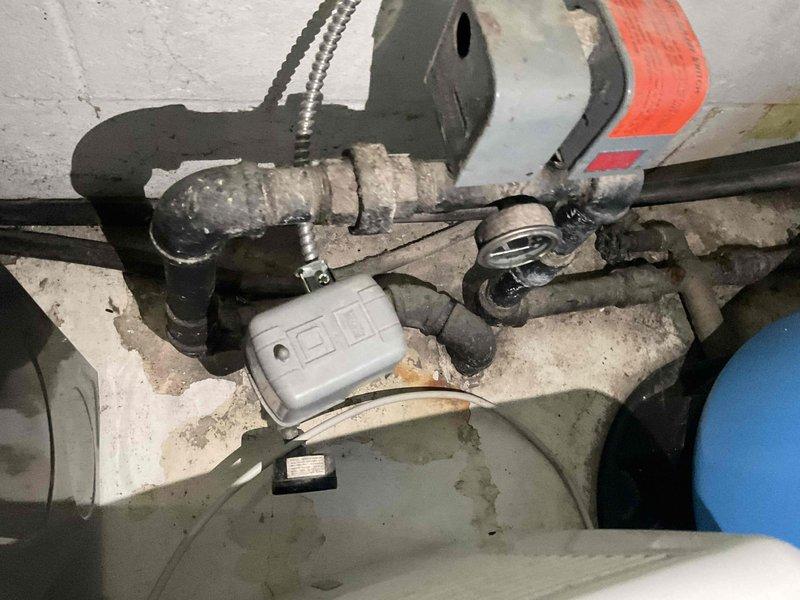 Responded to service call for non-functional 40-gallon water heater with no hot water production. Upon inspection, assessed existing tank-style water heater system and surrounding plumbing infrastructure in mechanical room. Documented current installation including water supply lines, pressure relief valve configuration, and existing piping connections. Discussed replacement options with customer, including conventional tank water heater versus tankless system alternatives. Photographed existing equipment and installation for replacement planning and customer review.