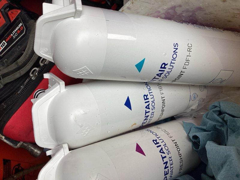 Completed routine maintenance on residential water filtration system by replacing three filters in a four-stage reverse osmosis unit. The membrane filter was not replaced during this service as it was not yet due for replacement. Customer was advised that all four filters, including the membrane, will require replacement during next year's scheduled maintenance. No leaks or operational issues were identified during the service call, and the system was returned to normal operation.