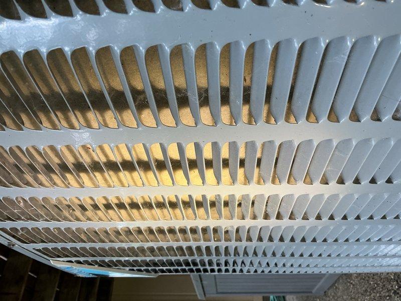 Responded to no cooling complaint on residential AC system. Upon arrival, found thermostat calling for cooling but blower motor not operating and no indicator lights on furnace. Voltage check confirmed no power to unit. Located tripped furnace switch at breaker panel in garage and reset. Verified blower motor operation and confirmed AC system functionality. Measured supply and return air temperatures with delta-t reading of 20 degrees, indicating proper system performance. Inspected outdoor condensing unit and found condenser coils heavily obstructed with cottonwood debris, restricting airflow. Advised homeowner of condition and recommended cleaning outdoor coil. Homeowner elected to perform coil cleaning themselves. Restored power and verified system operating properly before departure.