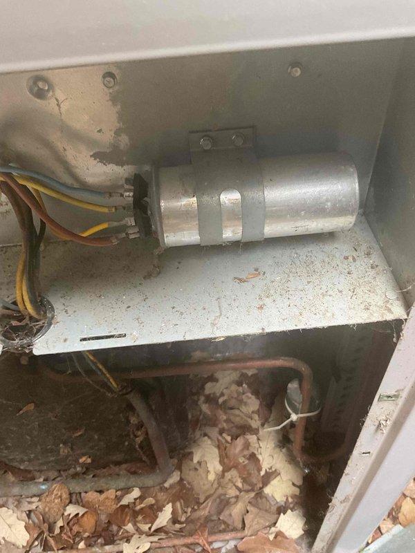 Responded to no cooling complaint on 5-year-old residential AC system. Upon inspection, diagnosed failed capacitor and low refrigerant charge as root causes preventing proper cooling operation. Replaced defective capacitor and recharged system to manufacturer specifications, restoring full cooling functionality.
