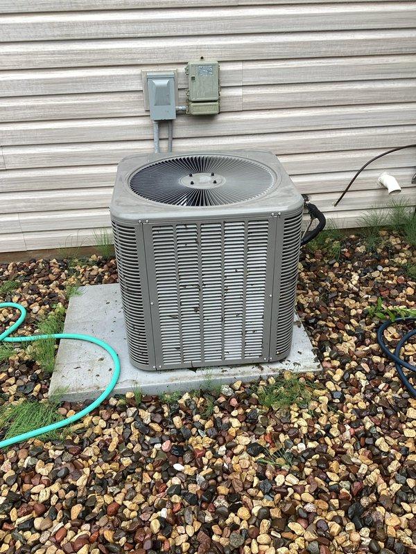 Responded to no cooling complaint on 4-year-old Lennox air conditioning system. Upon inspection, found outdoor condenser unit with excessive dirt and debris accumulation on coil fins restricting airflow. Cleaned condenser coil and exterior components to restore proper airflow. Performed refrigerant charge verification and discovered system operating with low refrigerant levels, indicating potential leak or improper initial charge. Advised property owner that low refrigerant on relatively new equipment should be covered under manufacturer or installation warranty and recommended contacting original installing contractor for warranty service and proper refrigerant leak diagnosis.