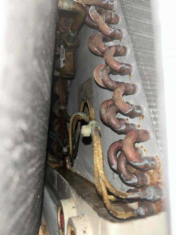 Responded to no cooling complaint on 10+ year old central air conditioning system with warm air from vents. Found outdoor unit failed to start due to high-pressure safety trip. Reset high-pressure switch by disconnecting wires from control board, allowing equipment to restart successfully. Monitored system operation for 25 minutes to verify proper function. Observed suction pressure reading slightly low but confirmed adequate cooling performance with 20-degree temperature split across evaporator coil. Evaporator coil showed proper refrigerant distribution with condensation forming along entire coil surface. Inspected outdoor condenser coil and confirmed clean condition with no obstructions or debris. Unable to identify specific cause of high-pressure trip as all components appeared to be functioning within normal parameters. Reset defrost board to restore system to factory settings. System operating properly at time of departure with no further issues detected.