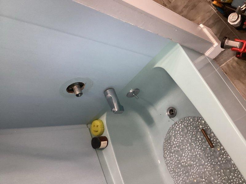 Responded to a tub leaking issue affecting the basement below. Upon inspection, identified a faulty shower valve and compromised tub drain assembly as the sources of water intrusion. Documented existing conditions with photographs of the bathtub fixtures and accessible plumbing in the basement/crawl space area. Provided detailed estimates for complete replacement of the defective shower valve and tub drain to resolve the ongoing leak.