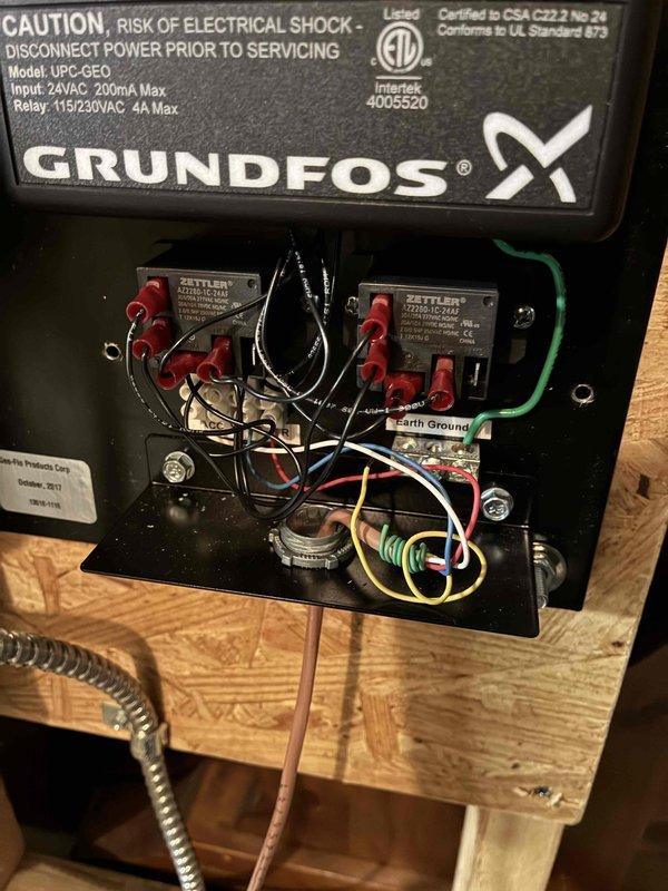 Responded to no cooling complaint on 8-year-old GeoComfort geothermal system unable to maintain 75°F setpoint, with indoor temperature reaching 79-80°F. Found unit in WF lockout condition upon arrival. Reset system and unit fired up normally. Performed comprehensive diagnostics including refrigerant pressure testing with manifold gauges—all readings within normal parameters. Removed ductwork to inspect evaporator coil, which showed proper sweating pattern across entire surface indicating adequate refrigeration. Verified loop field pressures were within acceptable range. Consulted with technical support regarding intermittent lockout condition; discussed possibility of loop field pump or pump relay failure as potential cause. Cycled system multiple times and monitored operation for over 30 minutes. System ran continuously without fault and reduced indoor temperature by 2 degrees during observation period. Inspected Grundfos UPC-GEO pump control module and associated relay components. Al