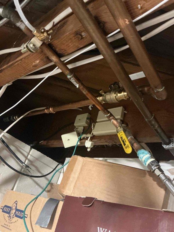 Responded to service call for multiple plumbing concerns including malfunctioning shut-off valves and leaking fixtures. Accessed crawl space to locate and replace defective shut-off valve serving exterior hose bib that was failing to stop water flow when closed. Replaced old, worn valve with new brass shut-off valve and verified proper operation. Replaced leaking exterior spigot with new frost-free hose bib. Inspected utility sink faucet and main water shut-off valve as requested, assessed condition and provided recommendations. All replaced components tested for proper function and leaks. Work completed in attic/crawl space area with copper pipe connections secured and system restored to full operation.
