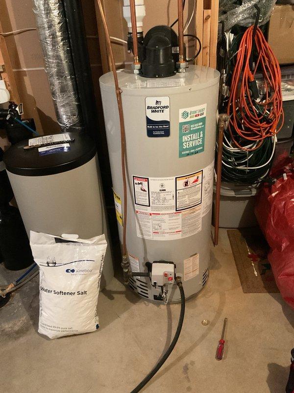 Completed biannual plumbing inspection including comprehensive water heater tune-up and seasonal maintenance. Drained and flushed Bradford White water heater as requested, inspected all connections, pressure relief valve, and verified proper operation. Adjusted exterior faucets for seasonal protection, inspected water softening system components and plumbing connections throughout utility area, and confirmed all systems operating within normal parameters.