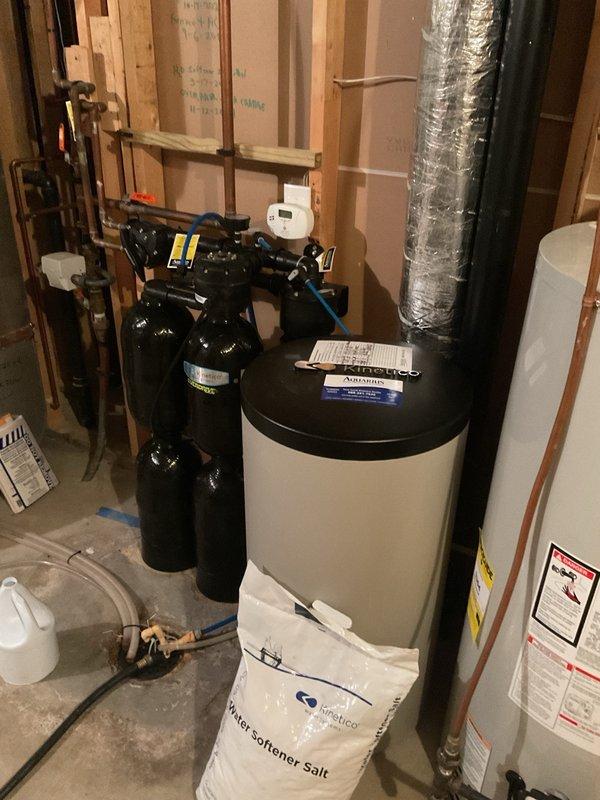 Completed biannual plumbing inspection including comprehensive water heater tune-up and seasonal maintenance. Drained and flushed Bradford White water heater as requested, inspected all connections, pressure relief valve, and verified proper operation. Adjusted exterior faucets for seasonal protection, inspected water softening system components and plumbing connections throughout utility area, and confirmed all systems operating within normal parameters.