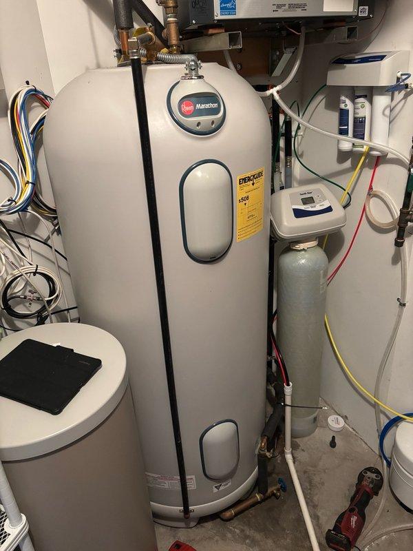 Responded to a water leak in the utility room where a pinhole leak was identified on the hot water recirculation line near the water heater. Upon inspection, confirmed the recirculation pump was no longer in use. Removed the compromised section of copper piping and installed new copper pipe and fittings to restore system integrity. Reopened isolation valves and performed pressure testing to verify no additional leaks were present. System returned to full operational status with all connections secure and leak-free.