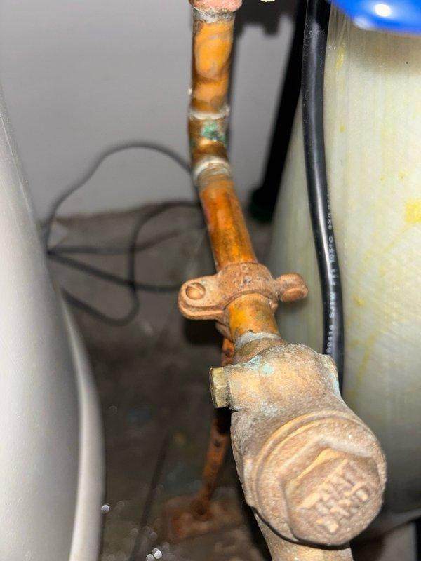 Responded to a water leak in the utility room where a pinhole leak was identified on the hot water recirculation line near the water heater. Upon inspection, confirmed the recirculation pump was no longer in use. Removed the compromised section of copper piping and installed new copper pipe and fittings to restore system integrity. Reopened isolation valves and performed pressure testing to verify no additional leaks were present. System returned to full operational status with all connections secure and leak-free.