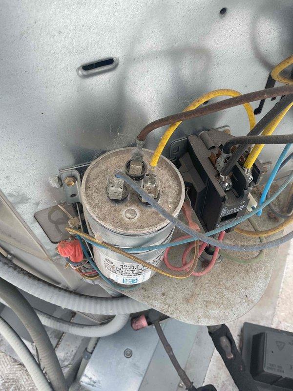 Responded to no cooling complaint on rooftop unit. Upon arrival, confirmed system was running but not providing adequate cooling. Performed diagnostic testing and identified low refrigerant charge as the cause of insufficient cooling. Inspected system components including capacitor and electrical connections, which showed normal wear consistent with unit age. Discussed repair options with customer, noting that refrigerant recharge and replacement costs were comparable due to system condition. Unit assessed and customer provided with recommendations for restoring cooling capacity.